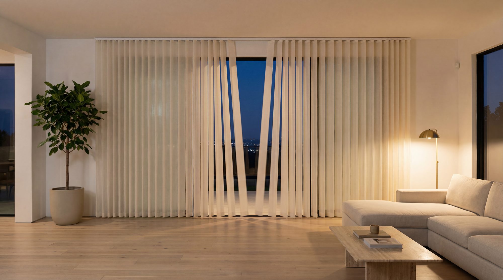 Dream Blinds vertical sheer shades with parted vanes revealing a city skyline at night — showing the walk-through capability